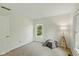 Neutral bedroom with large windows, and a modern floor lamp at 5208 Clear Lake Ct, Carmel, IN 46033