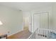 Bedroom featuring a crib, a reading chair and a closet at 5208 Clear Lake Ct, Carmel, IN 46033