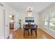 Elegant dining room with hardwood floors and a stylish chandelier at 5208 Clear Lake Ct, Carmel, IN 46033