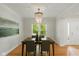 Dining room with chandelier, hardwood floors, and large window at 5208 Clear Lake Ct, Carmel, IN 46033