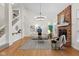 Living room features a fireplace, a staircase, and hardwood floors at 5208 Clear Lake Ct, Carmel, IN 46033