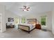Spacious main bedroom with large windows and a comfortable seating area at 5208 Clear Lake Ct, Carmel, IN 46033