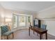 Charming office with a bay window offering natural light, a work desk and comfortable chairs at 5208 Clear Lake Ct, Carmel, IN 46033