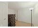 Storage room with carpet floors showing large stack of floor padding and a floor lamp at 5208 Clear Lake Ct, Carmel, IN 46033