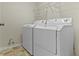 Convenient laundry room with appliances and shelving at 6275 Eller Creek Way, Fishers, IN 46038