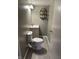 Cozy bathroom with modern toilet, sink, updated fixtures, and shelving at 6632 Sargent Rd, Indianapolis, IN 46256
