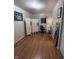 Bedroom featuring hardwood floors, a screen divider and black office chair by a window at 6632 Sargent Rd, Indianapolis, IN 46256