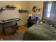 Fun bedroom featuring built-in shelving with collectibles, hardwood floors and a desk for gaming or listening to music at 6632 Sargent Rd, Indianapolis, IN 46256