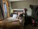 Charming bedroom with a decorative headboard, teddy bear, and comfortable bedding at 6632 Sargent Rd, Indianapolis, IN 46256