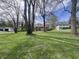 A beautifully landscaped front yard frames this charming home at 6632 Sargent Rd, Indianapolis, IN 46256