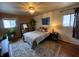 Cozy main bedroom featuring two windows for ample natural light, a large bed and decorative lighting at 6632 Sargent Rd, Indianapolis, IN 46256