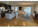 Open-concept kitchen and dining area with hardwood floors, perfect for modern living and entertaining at 6632 Sargent Rd, Indianapolis, IN 46256