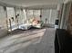 Inviting sun room with a large window view, comfortable seating, and plenty of natural light at 6632 Sargent Rd, Indianapolis, IN 46256