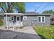 View of home's back exterior, including porch with stairs to backyard at 806 S 17Th St, Elwood, IN 46036