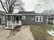 Charming home featuring an outdoor space with fresh green grass and an inviting back porch at 806 S 17Th St, Elwood, IN 46036