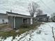 The backyard offers a detached garage and ample space for outdoor enjoyment at 806 S 17Th St, Elwood, IN 46036