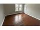Cozy bedroom features natural light from windows, complemented by hardwood flooring at 806 S 17Th St, Elwood, IN 46036