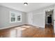Bedroom features beautiful hardwood floors, a window, and grey walls at 806 S 17Th St, Elwood, IN 46036