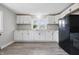 Modern kitchen with white cabinets, modern countertops, and updated appliances at 806 S 17Th St, Elwood, IN 46036