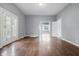Bright living room with hardwood floors, light walls, and glass doors at 806 S 17Th St, Elwood, IN 46036