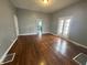 Spacious living room showcasing wood floors and a seamless transition to other areas at 806 S 17Th St, Elwood, IN 46036