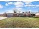 Charming single-story brick home featuring a well-maintained front lawn and attached garage at 8543 W 10Th St, Indianapolis, IN 46234