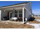Back porch features a table with seating and an outdoor grill at 9101 S Stone Trace S Blvd, Avon, IN 46123