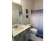 Bathroom featuring single sink vanity with chrome faucet, gray cabinets, and shower with curtain at 9101 S Stone Trace S Blvd, Avon, IN 46123