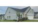 Attractive two-story home with gray siding, well-maintained landscaping, and attached two car garage at 9101 S Stone Trace S Blvd, Avon, IN 46123