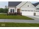 Charming single Gathering home with well-manicured lawn, brick accents, and attached two car garage at 9101 S Stone Trace S Blvd, Avon, IN 46123