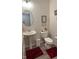Half-bathroom featuring pedestal sink, decorative accents, and neutral tones at 9101 S Stone Trace S Blvd, Avon, IN 46123