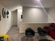 Upstairs living area featuring a red sofa, black chairs, and neutral carpet at 9101 S Stone Trace S Blvd, Avon, IN 46123