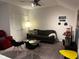 Cozy living room with plush seating, modern decor, and a ceiling fan at 9101 S Stone Trace S Blvd, Avon, IN 46123