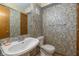 Cozy bathroom with pedestal sink and decorative wallpaper, offering a unique design at 1156 Canterbury N Sq, Indianapolis, IN 46260