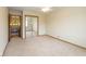 Bedroom with mirrored closet doors and view to another room at 1156 Canterbury N Sq, Indianapolis, IN 46260