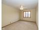 Neutral bedroom with a ceiling fan and a window with a view of a house at 1156 Canterbury N Sq, Indianapolis, IN 46260