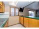 Cozy kitchen area with a bright window, breakfast bar and adjacent room at 1156 Canterbury N Sq, Indianapolis, IN 46260