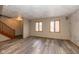 Bright living room with new wood floors, neutral paint, and natural light from large windows at 1156 Canterbury N Sq, Indianapolis, IN 46260