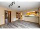 Open living room with hardwood floors and view of kitchen passthrough, perfect for entertaining at 1156 Canterbury N Sq, Indianapolis, IN 46260