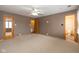 Spacious main bedroom features a ceiling fan, large windows, and ensuite bathroom at 1156 Canterbury N Sq, Indianapolis, IN 46260