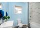 Bathroom featuring modern sink and a shower with white marble tile at 117 W 36Th St, Indianapolis, IN 46208