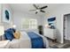 Cozy bedroom featuring a ceiling fan, natural light, and tasteful decor at 117 W 36Th St, Indianapolis, IN 46208