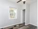 Bedroom featuring a window with a view of the neighborhood, with wood-look flooring at 117 W 36Th St, Indianapolis, IN 46208