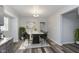 Dining room with modern table, stylish chairs, chandelier, and natural light at 117 W 36Th St, Indianapolis, IN 46208
