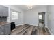 Well-lit dining area adjacent to the kitchen, with hardwood-style flooring and modern lighting at 117 W 36Th St, Indianapolis, IN 46208