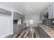 Spacious kitchen with grey cabinets, mosaic tile backsplash, and stainless steel sink at 117 W 36Th St, Indianapolis, IN 46208
