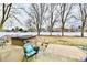 Backyard featuring a small patio and hot tub, as well as mature shade trees and a fence at 11710 E 75Th St, Indianapolis, IN 46236