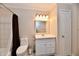 Bathroom featuring vanity with mirror, toilet, shower/tub with neutral tones at 11710 E 75Th St, Indianapolis, IN 46236