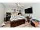 Bright bedroom with a ceiling fan, laminate floors, a flat-screen TV, and natural light at 11710 E 75Th St, Indianapolis, IN 46236