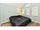 Cozy bedroom with natural light, vaulted ceiling, and a comfortable bed at 11710 E 75Th St, Indianapolis, IN 46236